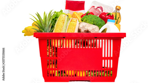 Foto Red plastic shopping basket filled with fresh groceries and healthy food isolate