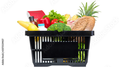 Quadro su tela Black shopping basket filled with fresh groceries and vegetables isolated on tra