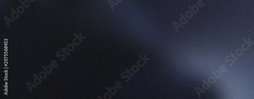 Deep blue cinematic grain texture with elegant light beam across dark surface for premium presentation.