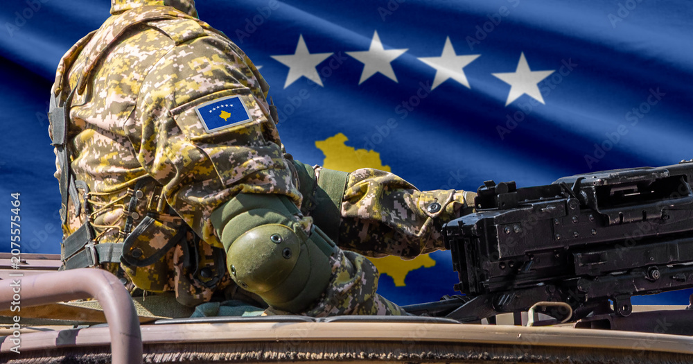 Fototapeta premium Kosovo flag with soldier at machinegun turret