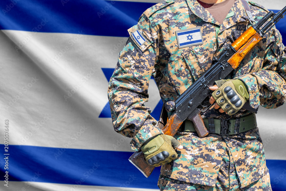 Fototapeta premium Israel flag with soldier holding assault rifle