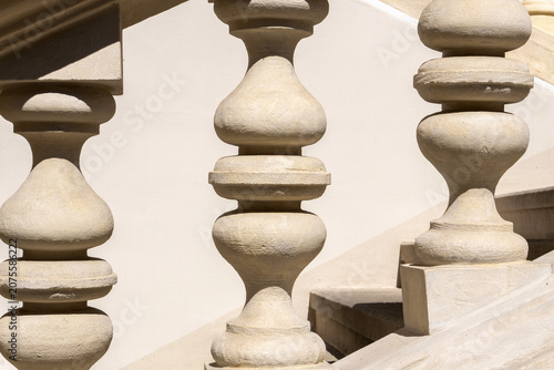 Classic stone balusters made of sandstone. Traditional staircase railing. Krakow. Poland