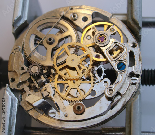 Macro photography concept of internal mechanism and vintage gears of a mechanical watch under repair