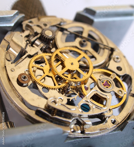 Macro photography concept of internal mechanism and vintage gears of a mechanical watch under repair