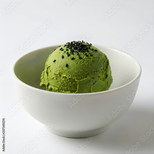 Single scoop of matcha green tea ice cream in a simple white ceramic bowl on white background