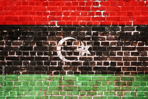Fotografie Vibrant Libyan National Flag Painted on a Distressed Red, Black, and Green Brick