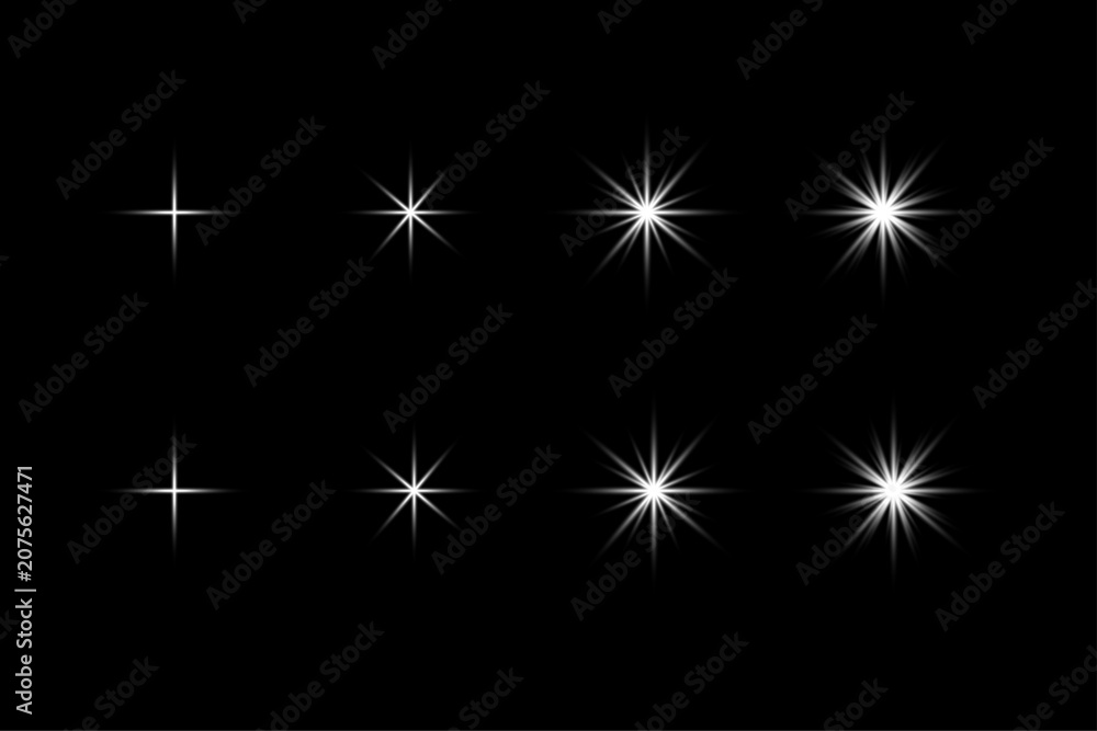 Fototapeta premium Collection of eight white starburst light effects on black background flare