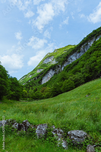 The view of Lake Tenno, a splendid alpine lake nestled between mountains and woods, near Lake Garda, near the town of Tenno, Trentino, Italy - May 2026