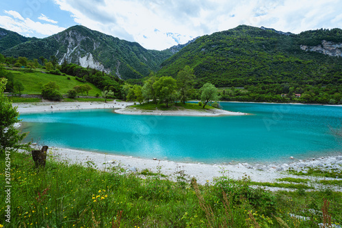 The view of Lake Tenno, a splendid alpine lake nestled between mountains and woods, near Lake Garda, near the town of Tenno, Trentino, Italy - May 2026