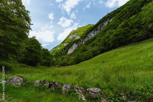 The view of Lake Tenno, a splendid alpine lake nestled between mountains and woods, near Lake Garda, near the town of Tenno, Trentino, Italy - May 2026