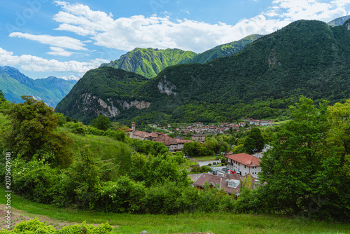 The view of Lake Tenno, a splendid alpine lake nestled between mountains and woods, near Lake Garda, near the town of Tenno, Trentino, Italy - May 2026