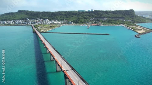 Aerial view of a bridge in the turquoise sea, Okinawa, Japan.