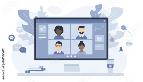 Team members participating in a video conference call on a computer monitor with colleagues in a clean and modern office workspace.