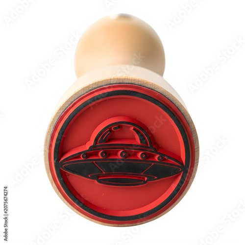 Red stamp with ufo illustration on white surface