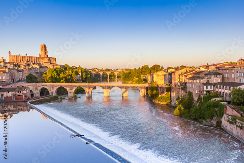 Bridges over the Tarn river and historic cathedral at sunrise in Albi, France