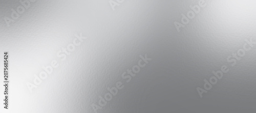 Silver foil texture background with light reflection. Christmas gift background