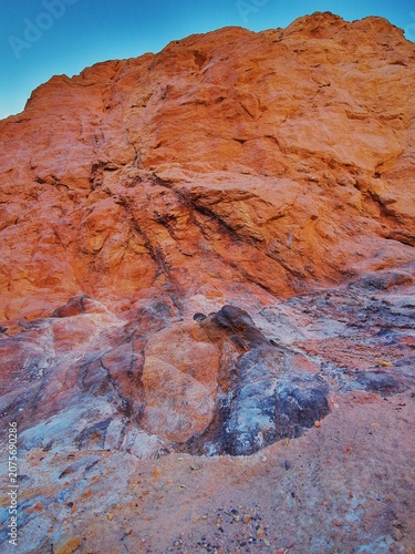 Dramatic red sandstone formations and desert landscapes near Eilat, Israel. Scenic views of the Red Canyon area featuring rugged cliffs, colorful rock textures and arid mountain terrain