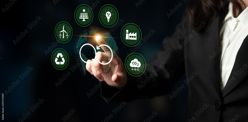 Obraz premium A professional businessperson interacts with digital icons representing sustainability and the circular economy, symbolizing future innovations in various sectors. Cyphers