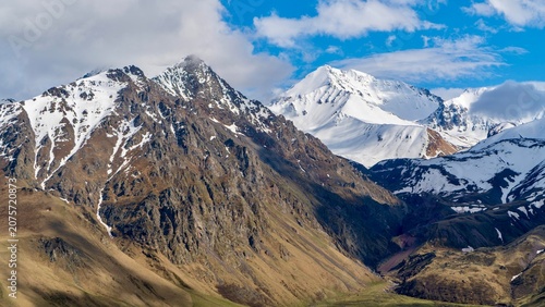 Canvas Print Dzhily Su, Russia - June 4, 2026: Scenic view of snow-covered peaks in the Cauca