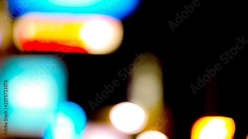 Fotografia Vibrant abstract bokeh lights creating a dazzling blurred effect against a dark