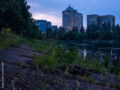 Cuadro en lienzo Kyiv's Rusanivka residential area buildings illuminated at dusk, reflecting ligh