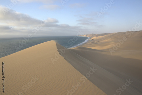 Namib Desert Sand Dunes Meeting Atlantic Ocean at Skeleton Coast, Namibia - Aerial Landscape Panorama