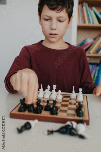 Boy is playing chess