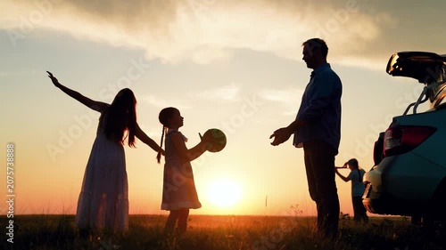 Parents and their daughter's children fun outdoors. Mom dad, children camping in car. Mom dad, children playing ball, family trip in nature. Happy family traveling by car. People, family, travel by