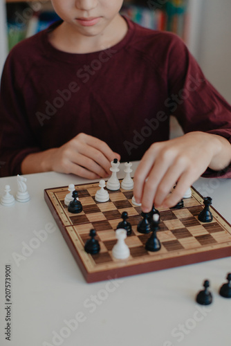 Boy is playing chess