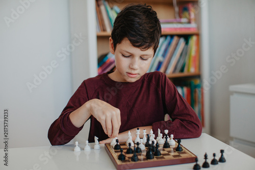 Boy is playing chess