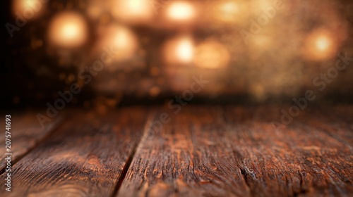 Empty rustic wooden tabletop with warm golden bokeh lights background