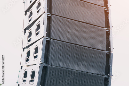 фотографія Stacked line array speakers creating high quality audio for a concert or live pe