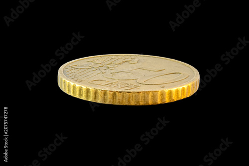 Side-angle view of a 50-cent Euro coin's reverse. Features the face value and European map on a golden-toned Nordic gold surface, isolated on a plain transparent black background.