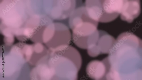 Abstract pink and purple bokeh lights on dark background
