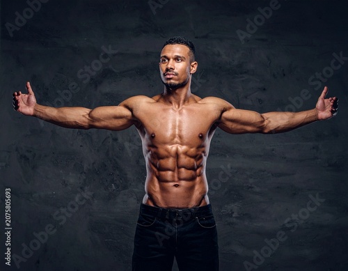 Muscular man with arms spread wide