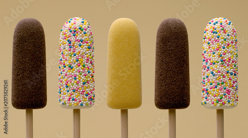 popsicles of various flavors, some with sprinkles, some lemon or chocolate; flavored banana treats