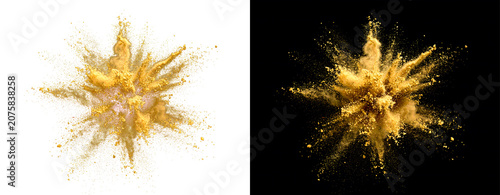 Golden powder explosion on white and black.
