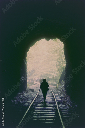 Woman Walking Along Railroad Tracks Though Large Tunnel - 35mm Film Negative Digital Scan