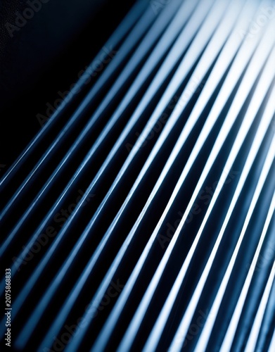 Plakat Abstract blue metallic lines with light reflections creating a sleek pattern
