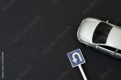 Принти на полотні vehicle and U-turn sign representing traffic regulations and safety