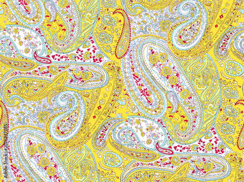 Abstract floral paisley pattern with swirling vines and leaves on yellow background
