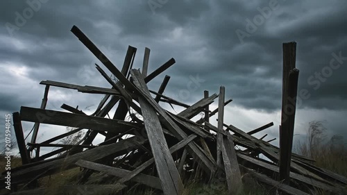 Collapsed Wooden Structure Under Stormy Dark Sky.