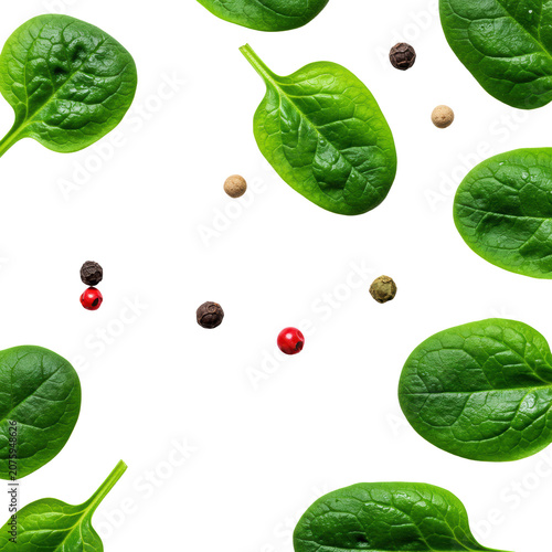 Fresh vibrant green spinach leaves with dewdrops and colorful peppercorns artfully arranged on a transparent background with soft diffused lighting, top-down flat lay, concept of healthy gourmet