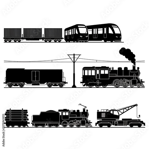 Black and white vintage train station with multiple trains.