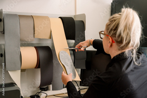 Female podiatrist creating custom insoles for foot care
