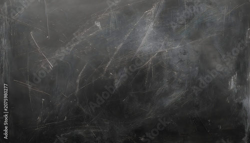 A scratched and weathered black surface with white marks and scratches all over it, giving a worn and aged appearance always