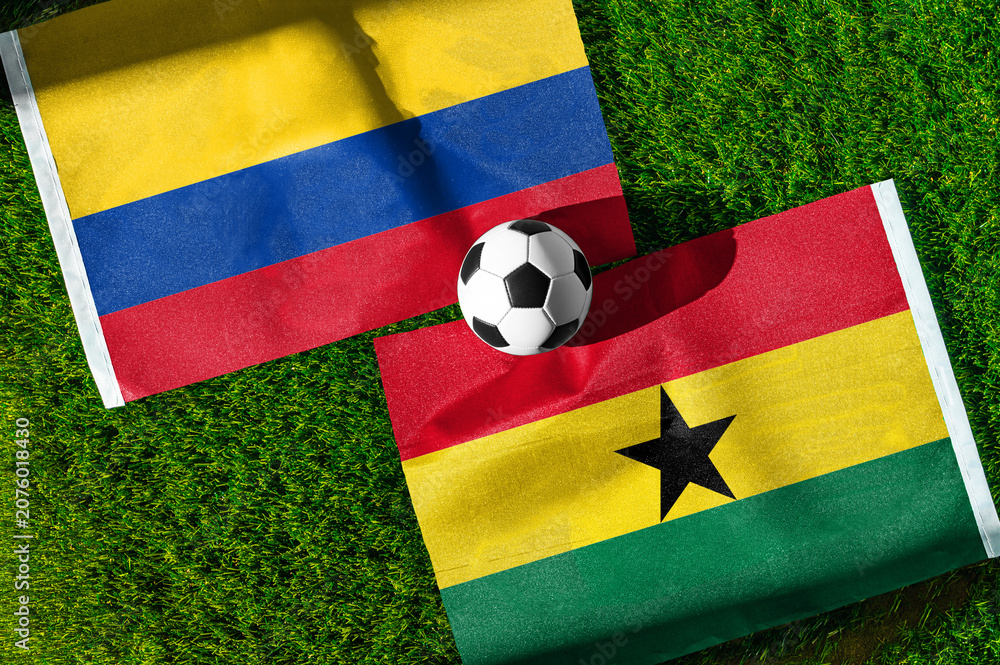 Fototapeta premium Colombia vs Ghana, national flags before international football tournament Round of 32 match, football on green grass with goal in the background, Kansas City, Missouri, USA, July 3, 2026