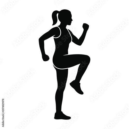 Silhouette of a woman doing high knees exercise