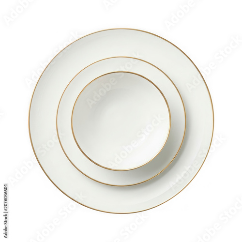 Elegant White Dinnerware Set with Gold Rim Detail.