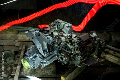 old gear shift box from a front-wheel drive car installing cables and shifting gears disassembly for repair
